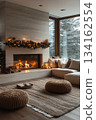 Cozy living room with lit fireplace and Christmas tree 134162554
