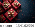 Bunch of red boxes with gold bows on them are on black background 134162559