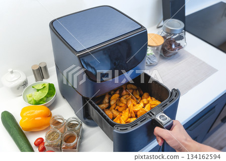 Air fryer machine in the kitchen 134162594