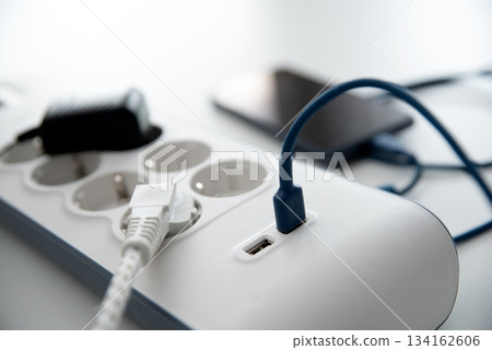 Smartphone charging at home with smart power strip Smartphone charging at home with smart power strip 134162606
