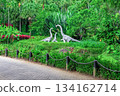 Installation A family of brachiosaurus dinosaurs among dense tropical greenery in Yanoda Park Hainan 134162714