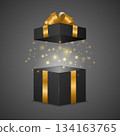 Open Black Gift Box with Gold Ribbon Bow and Magic Glow Vector 3d Realistic Luxury Surprise Present with Sparkles Holiday Packaging for Christmas New Year Birthday Sale Black Friday Promotion 134163765