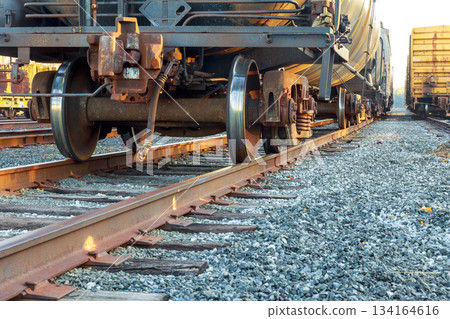 Train wheels on tracks near rail yard in quiet industrial area Train wheels on tracks near rail yard in quiet industrial area 134164616