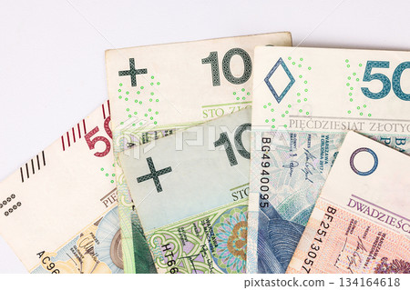 Various Polish banknotes arranged on a flat surface showing different denominations and designs Various Polish banknotes arranged on a flat surface showing different denominations and designs 134164618