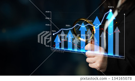 Business growth analysis with magnifying glass and digital graph illustration showing upward trends and success metrics on dark background Scalp Business growth analysis with magnifying glass and digital graph illustration showing upward trends and success metrics on dark background Scalp 134165078