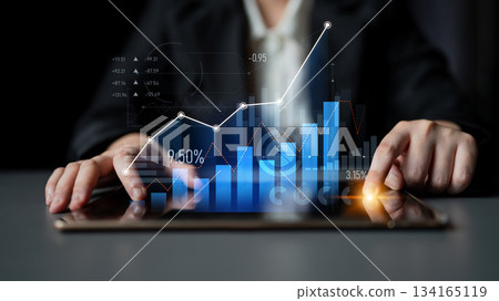 Professional Analysis of Financial Growth Trends with Data Visualization on a Tablet by a Business Person in a Modern Office Setting Scalp 134165119