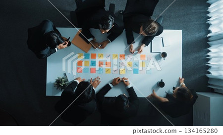 Smart business people writing and brainstorming business idea. Directorate. Smart business people writing and brainstorming business idea. Directorate. 134165280