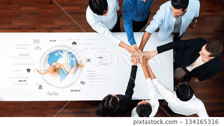 Team Collaboration and Innovation in the Digital Age with Hands Joined Around a World Map and Data Insights on a Table Trope Team Collaboration and Innovation in the Digital Age with Hands Joined Around a World Map and Data Insights on a Table Trope 134165316