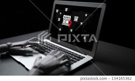 Futuristic robotic hand typing on laptop with global map and location marker, representing advanced technology and digital commerce concepts Gantry 134165362