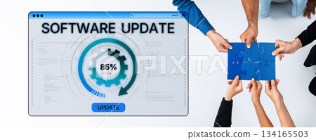 Hands of diverse individuals collaborating around a software update interface with progress indicator on a modern workspace background Trope 134165503