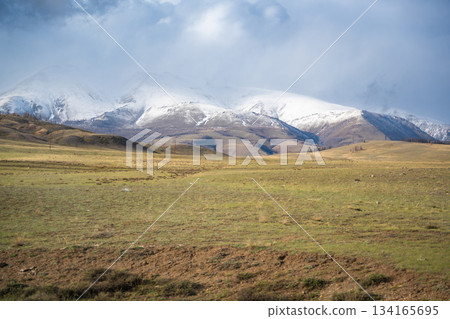 Mountain landscape of Chuysky Trakt Altai Russia. Expansive natural scenery featuring rugged peaks and valleys. Mountain landscape of Chuysky Trakt Altai Russia. Expansive natural scenery featuring rugged peaks and valleys. 134165695