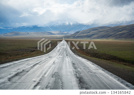 Mountain road and valley of Chuysky Trakt Altai Russia. Scenic route through rugged terrain and expansive natural landscape 134165842