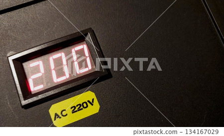 Charging Station Indicator Shows 200 With AC 220V Label During Use in a Facility 134167029