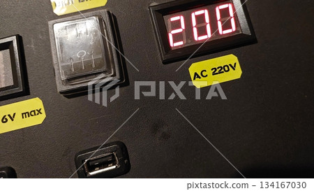 Indicator and Charging Station Display Located at an Electrical Panel in a Utility Area 134167030