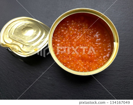 Red Salmon Caviar Stored in a Metal Jar Ready for Meal Preparation or Cooking 134167049