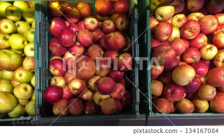 Market Display Features Fresh Apples in Containers During the Autumn Harvest Season 134167084