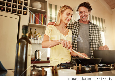 Food, support or happy couple kitchen cooking with healthy food or vegetables for lunch together at home. Affection or woman helping, smiling or talking to husband in meal preparation in Australia 134168419