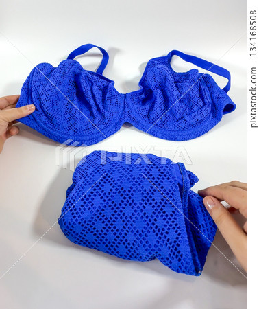 Blue Textured Swimwear Set on White Background 134168508