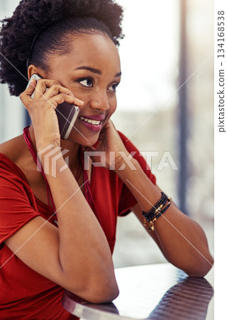 Phone call, smile and black woman talking at table, listening or conversation in restaurant. Cellphone, communication and African female person speaking, discussion and networking, thinking and chat. 134168538