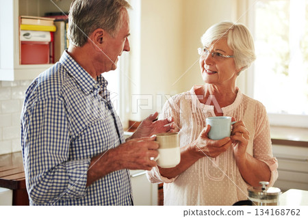 Chat, coffee or old couple talking in kitchen at home bonding or enjoying quality morning time together. Happy, retirement or senior man speaking, relaxing or drinking tea espresso with woman at home Chat, coffee or old couple talking in kitchen at home bonding or enjoying quality morning time together. Happy, retirement or senior man speaking, relaxing or drinking tea espresso with woman at home 134168762