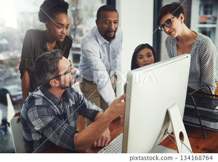 Teamwork, computer and pointing with business people in meeting for project management, review or planning. Technology, website and training with employees in office for collaboration and idea 134168764