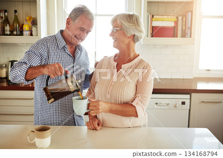 Happy, coffee or old couple talking in a kitchen at home bonding or enjoying quality morning time together. Love, wellness or mature man in conversation, relaxing or drinking espresso tea with woman Happy, coffee or old couple talking in a kitchen at home bonding or enjoying quality morning time together. Love, wellness or mature man in conversation, relaxing or drinking espresso tea with woman 134168794