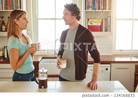 Relax, coffee or couple talking in a kitchen at home bonding or enjoying quality morning time together. Love, wellness or mature man in conversation, relaxing and drinking espresso tea with woman 134168833