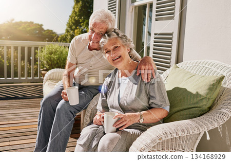 Hug, patio and portrait of senior couple with coffee enjoying bonding, quality time and relax in morning. Love, retirement and elderly man and woman embrace with drink for breakfast outdoors at home Hug, patio and portrait of senior couple with coffee enjoying bonding, quality time and relax in morning. Love, retirement and elderly man and woman embrace with drink for breakfast outdoors at home 134168929