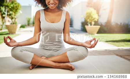 Happy woman, hands and yoga in meditation for spiritual wellness or healthy exercise on floor mat in zen garden. Hand of calm African female yogi in meditate for relax, mind or health and fitness Happy woman, hands and yoga in meditation for spiritual wellness or healthy exercise on floor mat in zen garden. Hand of calm African female yogi in meditate for relax, mind or health and fitness 134168988