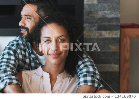 Love, hug and portrait of couple in home for commitment, loving embrace and trust in living room. Dating, marriage and face of man and woman smile for intimate moment, happy and together for romance 134169070