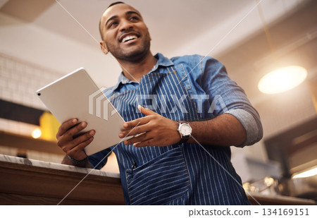 Coffee shop, tablet and smile with man in cafe for online, entrepreneurship and startup. African, technology and food industry with small business owner in restaurant for barista, network and waiter 134169151