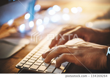 Hands, keyboard and closeup of man typing while doing research on a computer in the office at night. Professional, technology and male employee working overtime on a deadline project in the workplace Hands, keyboard and closeup of man typing while doing research on a computer in the office at night. Professional, technology and male employee working overtime on a deadline project in the workplace 134169264