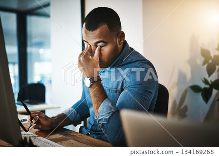 Burnout, headache and man in the office while working on a deadline project with eye strain at night. Stress, migraine and professional male employee doing research on computer in workplace overtime. Burnout, headache and man in the office while working on a deadline project with eye strain at night. Stress, migraine and professional male employee doing research on computer in workplace overtime. 134169268