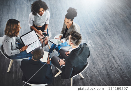 Discussion, planning and business people for meeting in office with documents and technology. Collaboration, team and top view of employees working with technology and paperwork together with mockup. Discussion, planning and business people for meeting in office with documents and technology. Collaboration, team and top view of employees working with technology and paperwork together with mockup. 134169297