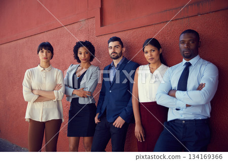Portrait, business people and diversity of serious team, professional commitment and collaboration against a red wall. Focused group of confident employees with corporate pride, trust and solidarity Portrait, business people and diversity of serious team, professional commitment and collaboration against a red wall. Focused group of confident employees with corporate pride, trust and solidarity 134169366