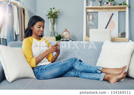 Sofa, phone and relax woman scroll, typing or message social network user, gen z contact or person. Lounge couch, home apartment and Indian girl reading cellphone, online shopping or app website info Sofa, phone and relax woman scroll, typing or message social network user, gen z contact or person. Lounge couch, home apartment and Indian girl reading cellphone, online shopping or app website info 134169511