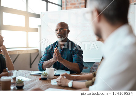 Business people, meeting leader and black man in office, talking or speaking. Teamwork, ceo and serious senior African male professional brainstorming, collaboration or planning group strategy 134169524