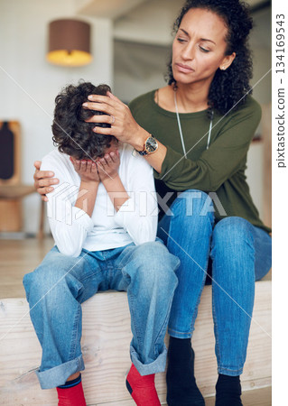 Sad, depression and a mother with crying child together in stairs for comfort, love and support. Depressed, empathy and anxiety or mental health problem of a kid with a woman in a family home Sad, depression and a mother with crying child together in stairs for comfort, love and support. Depressed, empathy and anxiety or mental health problem of a kid with a woman in a family home 134169543