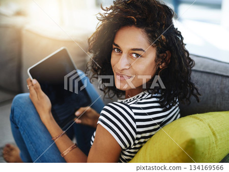 Relax, tablet and portrait of woman on sofa in home for network, online website and social media. Communication, mobile app and African female person on digital tech for chat, message and internet 134169566
