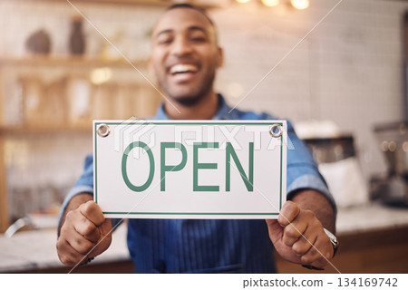 Open, sign and closeup of man in shop, store and advertising notice of retail shopping time, board or trading information. Hands of happy cafe owner with opening banner, welcome and startup services Open, sign and closeup of man in shop, store and advertising notice of retail shopping time, board or trading information. Hands of happy cafe owner with opening banner, welcome and startup services 134169742