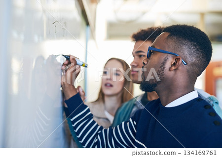 Diversity, students writing on whiteboard and in classroom of school building. Problem solving or formula, brainstorming or presentation and people write on board in class of college or university 134169761