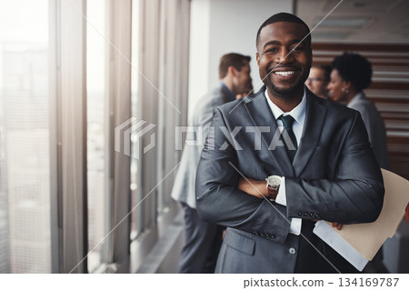 Black man in business, arms crossed with smile in portrait and leadership, corporate lawyer in meeting. Businessman in conference room, happy male person with confidence in company and management Black man in business, arms crossed with smile in portrait and leadership, corporate lawyer in meeting. Businessman in conference room, happy male person with confidence in company and management 134169787