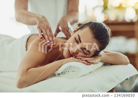 Relax, happy and massage with woman in spa for wellness, luxury and cosmetics treatment. Skincare, peace and zen with female customer and hands of therapist for physical therapy, salon and detox Relax, happy and massage with woman in spa for wellness, luxury and cosmetics treatment. Skincare, peace and zen with female customer and hands of therapist for physical therapy, salon and detox 134169850