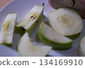 Cutted apples on a white plate 134169910