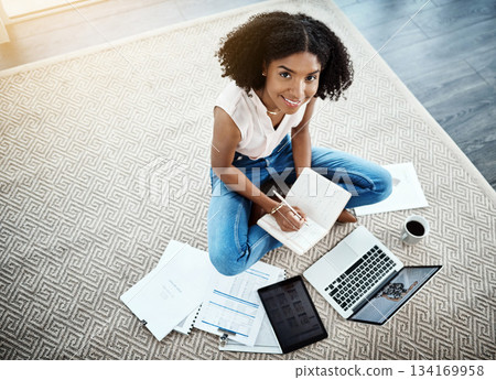 Laptop, notebook and woman on floor for work from home opportunity, financial planning and writing ideas from above. African person on computer, brainstorming and budget documents for happy startup 134169958