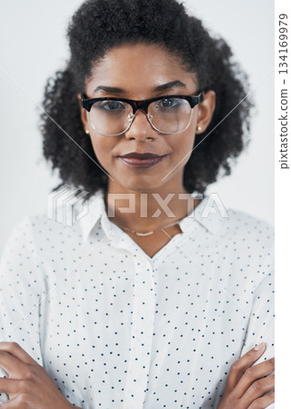 Serious, business and portrait of black woman with arms crossed in studio isolated on white background. Glasses, confidence or face of African female professional, entrepreneur or person from Nigeria Serious, business and portrait of black woman with arms crossed in studio isolated on white background. Glasses, confidence or face of African female professional, entrepreneur or person from Nigeria 134169979