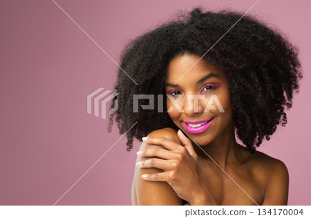 Hair care, face and smile of black woman with makeup in studio isolated on a pink background mockup for skincare. Hairstyle portrait, cosmetics and African female model with salon treatment for afro. 134170004