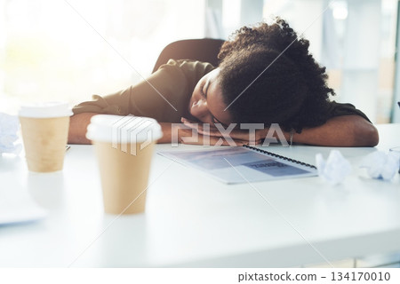 Nap, sleeping and business woman in office with fatigue, tired and exhausted from working. Burnout, overworked and African female worker overwhelmed with stress for deadline, workload and pressure 134170010