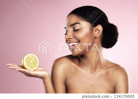 Lemon, healthy beauty and happy woman in studio mockup, pink background and smile for vitamin c benefits. African model, citrus fruits and natural skincare for cosmetics, vegan dermatology and detox Lemon, healthy beauty and happy woman in studio mockup, pink background and smile for vitamin c benefits. African model, citrus fruits and natural skincare for cosmetics, vegan dermatology and detox 134170085
