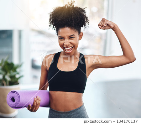 Black woman, flex and muscle for fitness or portrait of motivated athlete or yoga mat and happy for exercise indoors. Workout, training and girl runner energy or goal for muscle in gym for sports 134170137